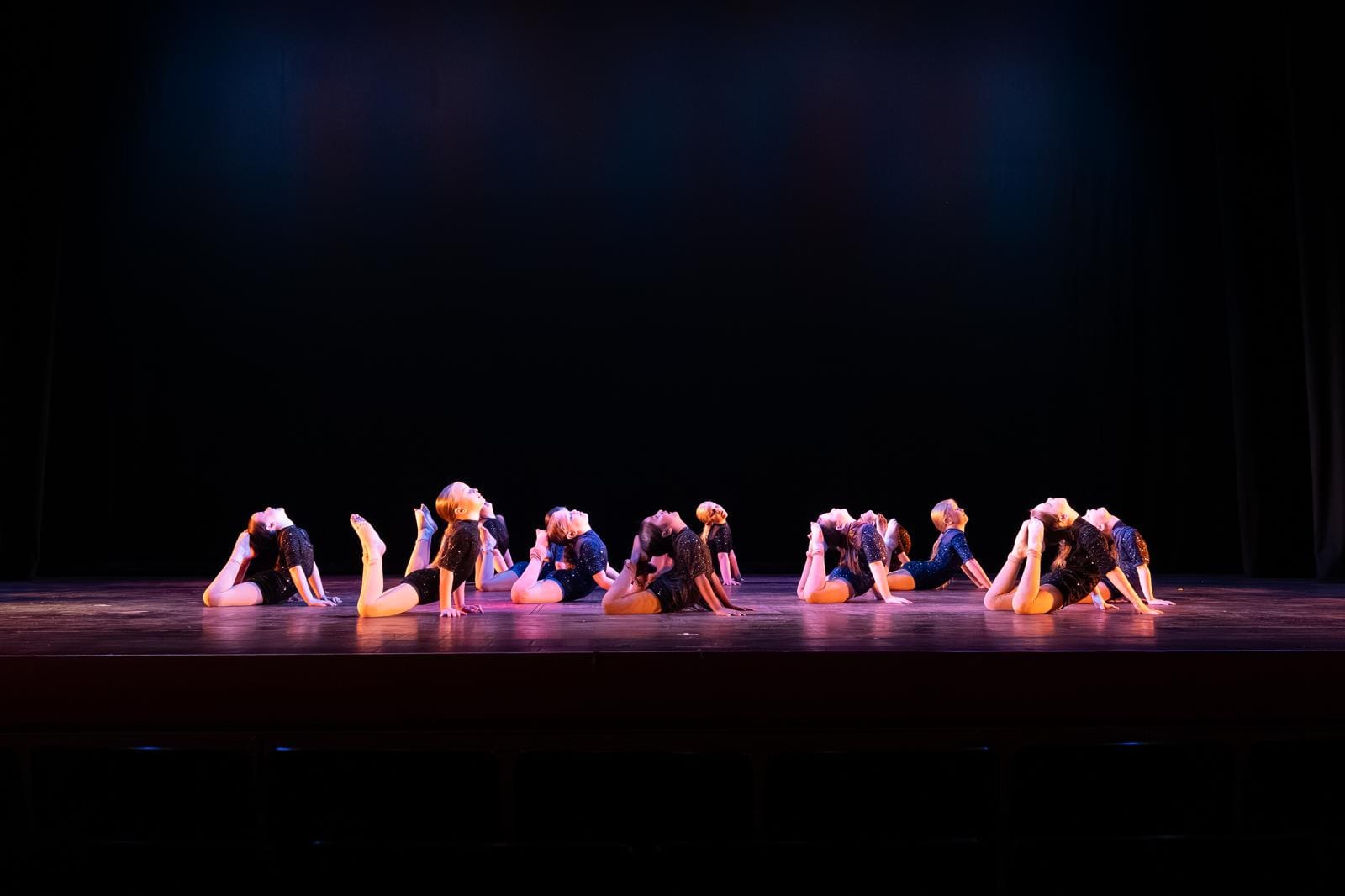 RFTS dancers performing acrobatics on stage